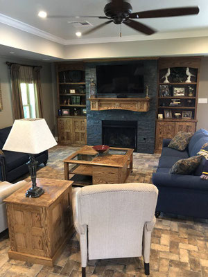 Jim added the doors & crown to the existing bookcases and also custom built the mantel, coffee table, and side table for this customer