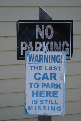 Interesting: Nobody parked here, but very close on the left and right side of this sign.