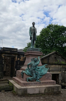 A. Lincoln on a tomb stone / monument
