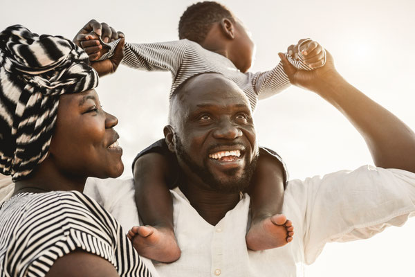 Woman, man, and child laughing