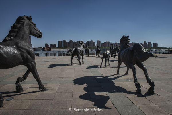 The square in the Wulan Mulun river, with the bronze statues of horses