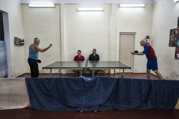 A game of ping pong at the gym of Chernobyl. Many workers come here to exercice after their shift in order to keep fit