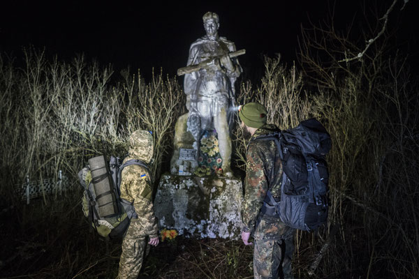 Jimmy and Maxim in front of the World War II memorial in the village of Chistogolovka. This village was so contaminated by the fallout of Chernobyl incident that was demolished and buried. The only memory is this statue, once located in the main square