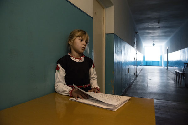 A girl with the results of examinations carried out at the Ivankiv hospital by Professor Bandazhevsky's team