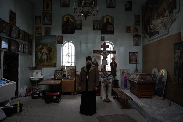The Pope Alexandr Liashuk of the Hostomel church during church repairs. The church was badly damaged by Russian bombardment.  Alexandr Liashuk was the pope of the main church in Mariupol. when the Russians arrived, he had to flee and took refuge here.