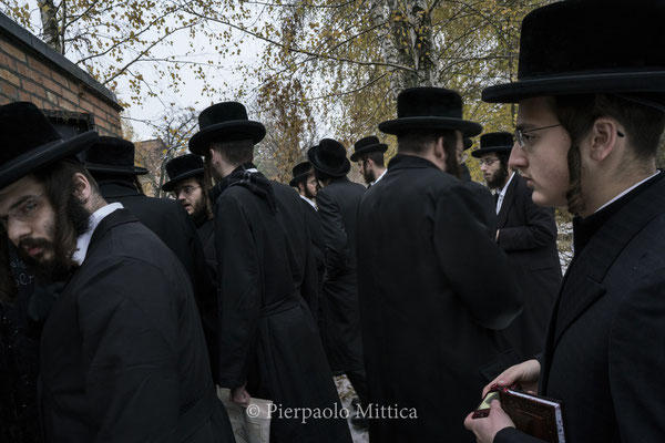 Jews in front the tombs of  Grand Rabbi Aharon Twersky Admur of Chernobyl and Grand Rabbi Menachem Nachum Twersky Admur of Chernobyl.