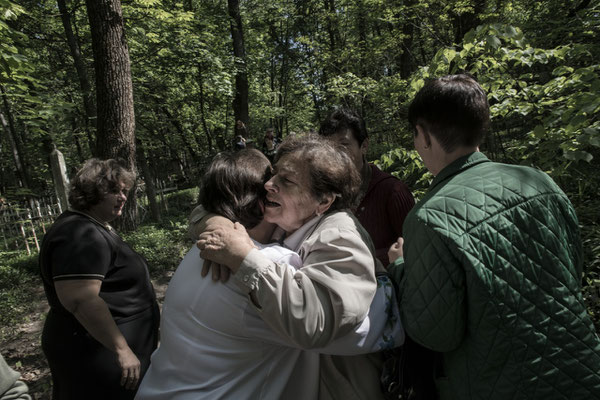 Former inhabitants of the area meet at the Chernobyl cemetery.