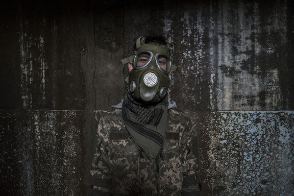 A stalker playing with a mock gas mask