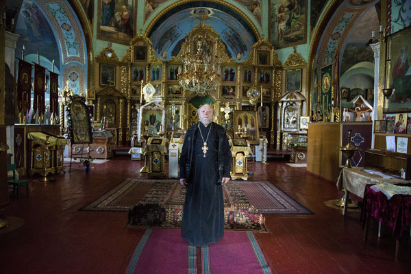 Priest Nikolai in the Orthodox church in the town of Chernobyl. At the time of the evacuation in 1986 he refused to leave. Since then he has always lived in Chernobyl town continuing to celebrate mass for the population