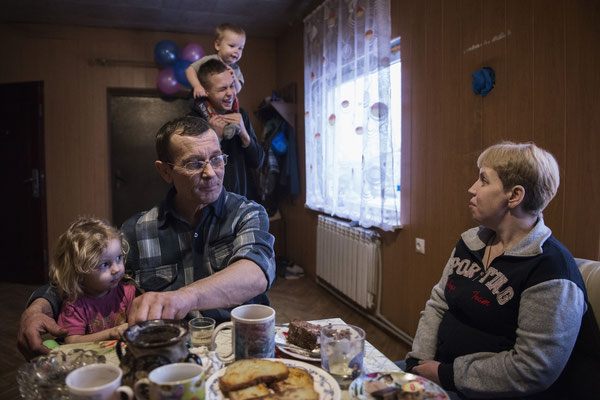 Victor with his family at home in the contaminated village of Kovalinka, situated just 5 kilometers from the border of the Chernobyl Exclusion Zone.