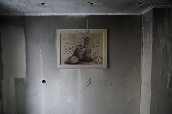 A painting in a flat destroyed by Russian bombing. Irpin is one of the outlying districts of Kyiv, during the first months of the war when the Russians tried to take the capital, this district was occupied and heavily bombed by the Russians. 