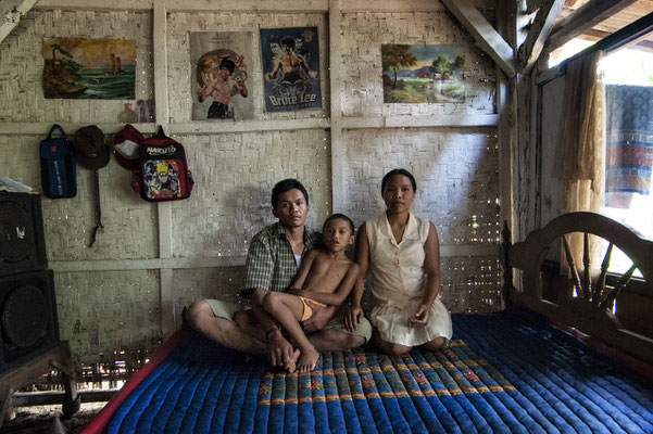 Ribut Santoso with his son and wife at home. They live in Sumberwatu village