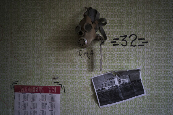 A gas mask hanged on a wall of an apartment occupied by stalkers in the ghost town of Pripyat.