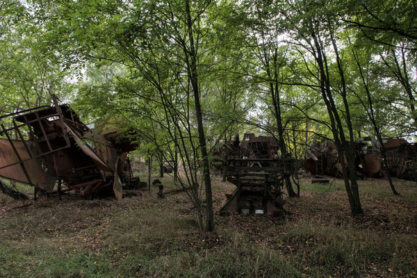 Farm machinery swamped by nature in the abandoned village of Kopachi, in the Chernobyl exclusion zone.