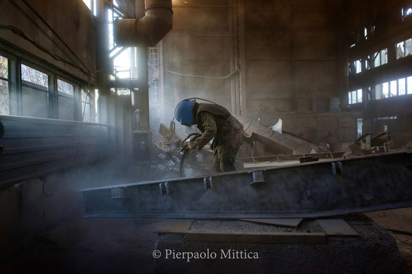 Yuriy while sandblasting the radioactive scrap metal 