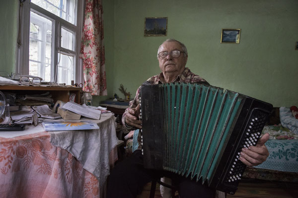 Chernobyl town. Mihail was the music teacher at the school in Chernobyl before the incident and now a pensioner, he has always lived in Chernobyl