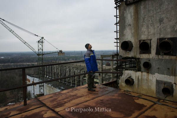 Victor inspecting Reactor Five to list the different metals to recycle.