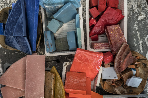 Spilimbergo (Pordenone, Italy), the Friuli School of Mosaic. Pieces of mosaic and glass ready to be used by the students to create mosaics.