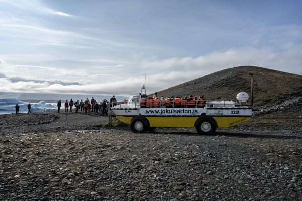 Iceland. Jökulsárlón Glacier Lagoon. Tourists wait to board an amphibious vehicle for a visit to the glacier. Glacier Lagoon is located in the Vatnajökull national park, in the south of Iceland, an area popular with tourists.