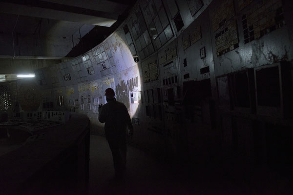 A worker inside the damaged control room of reactor number 4. Here everything began. The control room number four now is buried in a small sarcophagus of concrete and the access is limited to workers only.