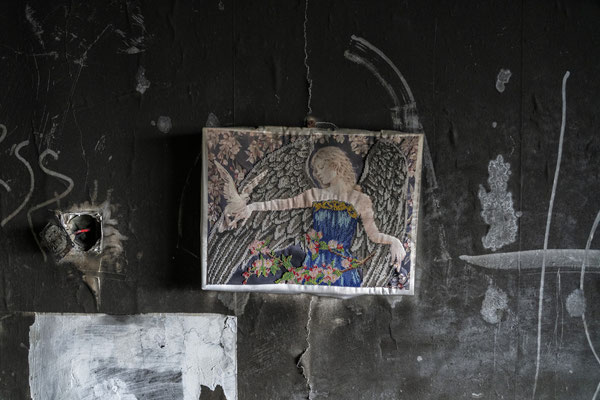 A painting in a flat destroyed by Russian bombing. Irpin is one of the outlying districts of Kyiv, during the first months of the war when the Russians tried to take the capital, this district was occupied and heavily bombed by the Russians.
