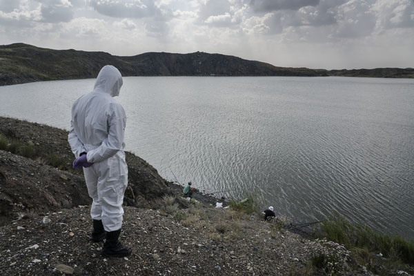 Amir Kayirjanov, a scientist at the Kurchatov nuclear center while observing some fishermen fishing in the atomic lake, one of the most contaminated places on the Semipalatinsk shooting range Many people come to the atomic lake to fish.