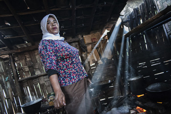 Siya, 40, lives in Tamansari village, she has a a small restaurant and she sells food for people working in Ijen