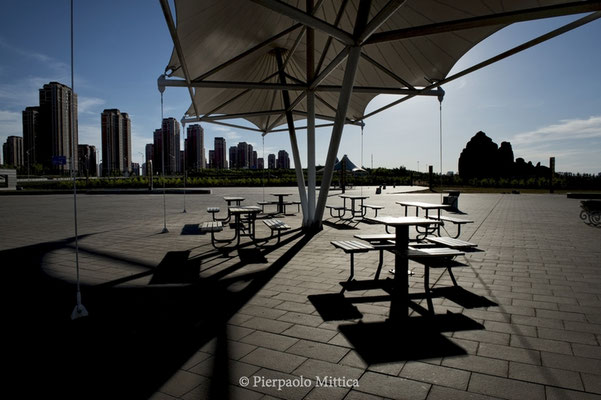  Empty tables in a never opened bar in the new district of Kangbashi, Ordos