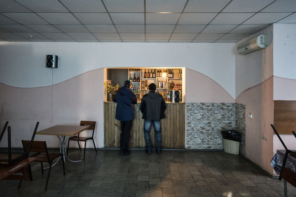 two customers at a bar in Chernobyl town