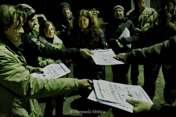 Yuriy Tatarchuck while giving to tourists diplomas certifying their visit to the exclusion zone