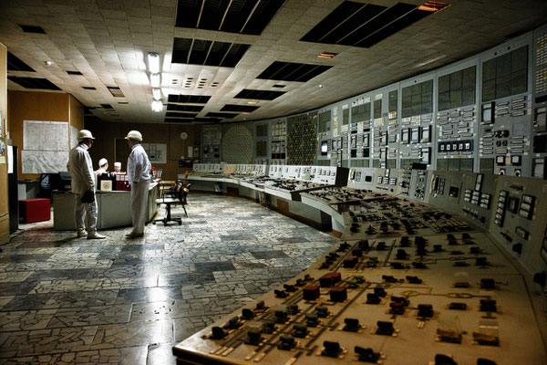 Workers inside control room of reactor number 2. Despite the reactors were shut down in 2000, all staff must continue working until 2065, date of reactors decomissioning, to maintain reactors safety.  