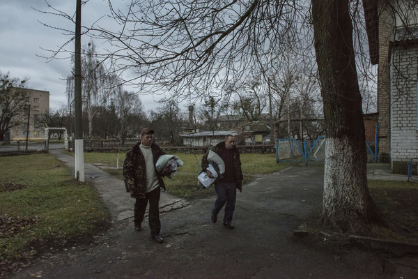 Chernobyl town. Workers return to their accomodation after their shift.