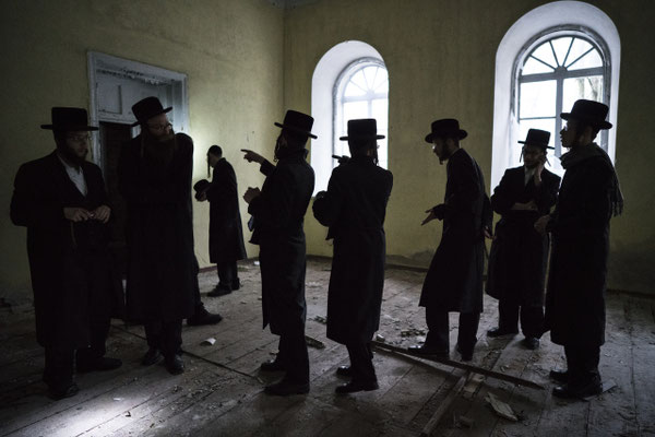 Jews inside the abandoned Chernobyl Synagogue.