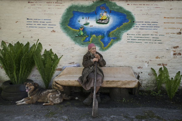 Alla Ivanova 87 years old, in front of her home in the abandoned city of Polesskoye town, inside the Chernobyl Exclusion Zone. Alla died on 23rd Janauary 2021.