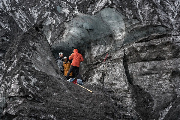 Iceland. During a trip to the Katla Volcano, tourists take photos in front of the ice cave.