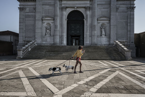 Walking with dogs in the square of the Redentore church, Giudecca