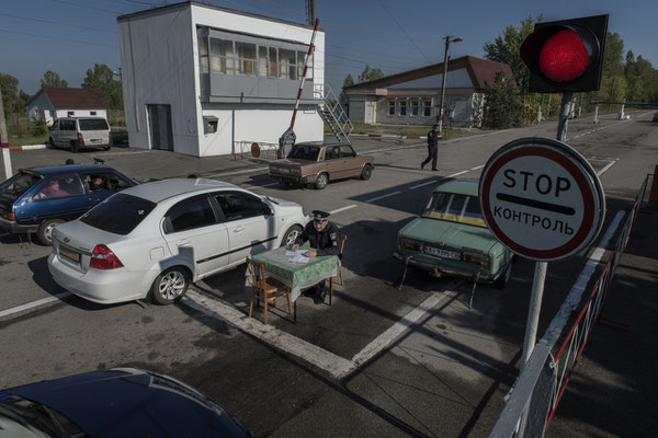 Former inhabitants queuing for checks to enter the Chernobyl exclusion zone.