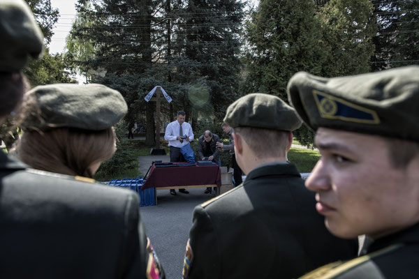 Military army celebrates the delivery of medals to former liquidators in the main square of the city of Chernobyl.