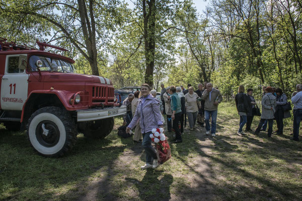 Former inhabitants on their way to the Chernobyl cemetery.