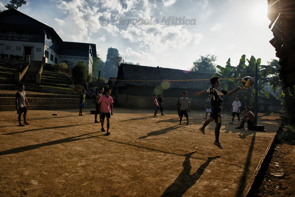 Refugees playing volleyball, Mae La Refugee camp, Thailand