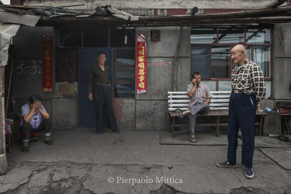 retired workers in the semi abandoned town of Qiabuqi. Qiabuqi town had 10 thousand inhabitants. Today only 300 people are still living here. 