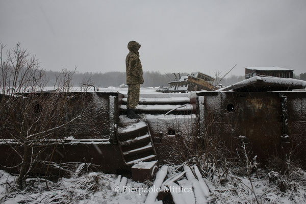 in search of scrap metals in the Chernobyl river port