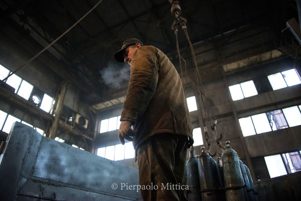  A worker while loading the scrap metals on the truck