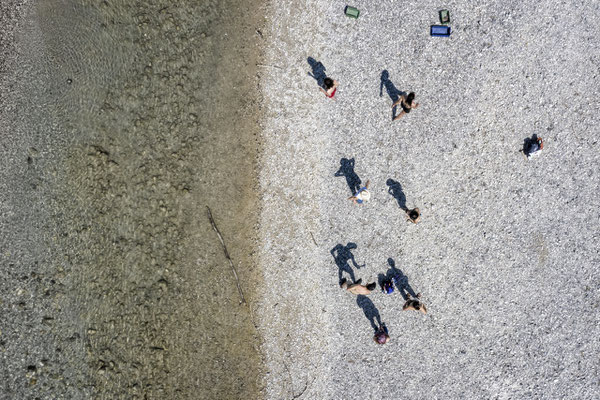 The students of the first year classroom searching for stones on the River Tagliamento