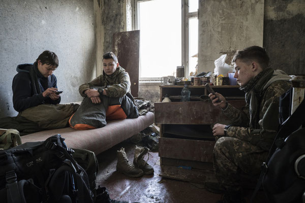 Young stalkers resting in their apartment in the ghost town of Pripyat.