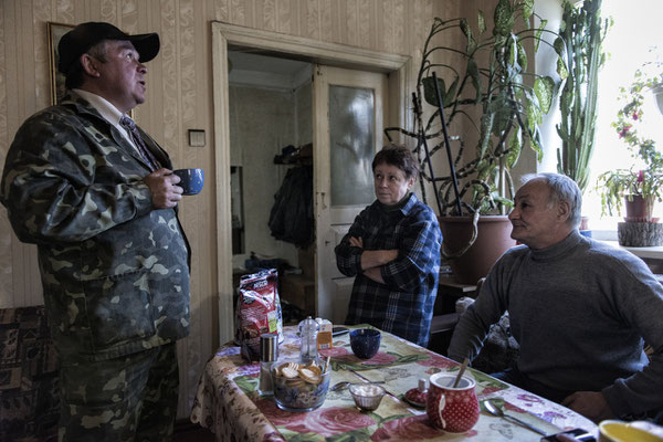 Biologist Elena Buntova with her husband Sergiy Lapiha and radiologist technician Valeri as they discuss the latest findings on plant contamination in the Chernobyl Exclusion Zone.