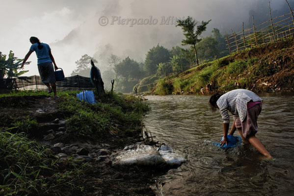 Taking water from the river to irrigate the fields, Mae La refugee camp, Thailand