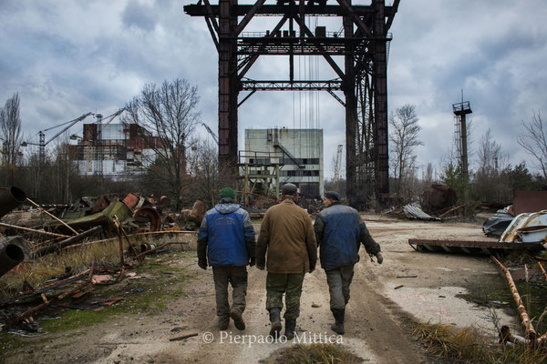 Workers going around to collect metals 