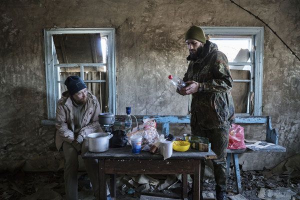 Sasha and Jimmy preparing lunch in the abandoned village of Rudnya Veresnya.