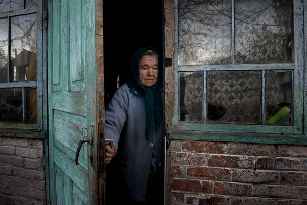 Maria Semenyuk, 78 years old, in her home waiting for her husband Ivan. On May, 17th 2016 Maria has died after living all her life in her home. She was buried in Paryshev cemetery. Paryshev, Chernobyl Exclusion Zone.